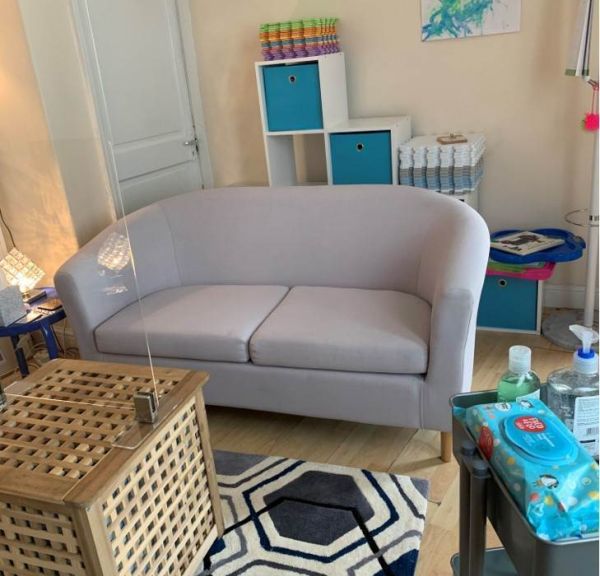 Picture of Alison's room showing table with wipes and hand sanitiser